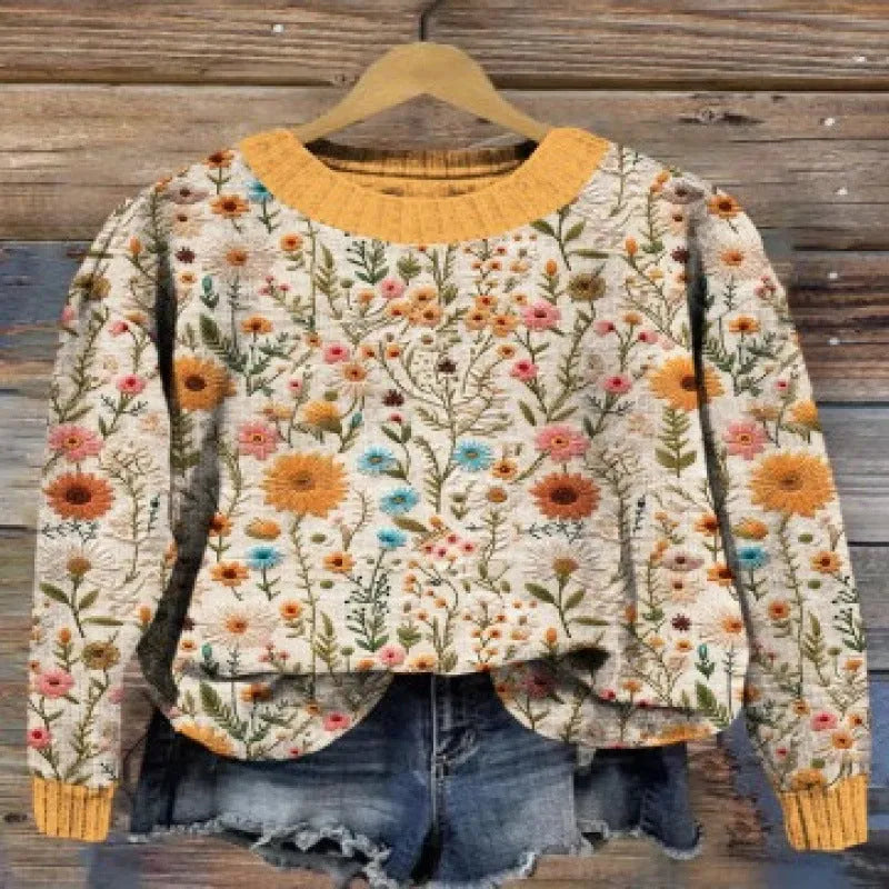Little Flower digital printed round neck long sleeve sweater on a hanger.