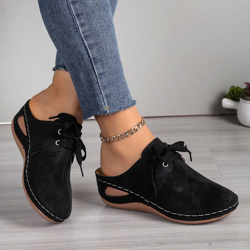 Women's black baotou lace-up slippers with hollow out wedge and suede upper on a rubber sole