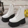 White women's platform boots with patchwork design, chunky block heel, and side zipper.