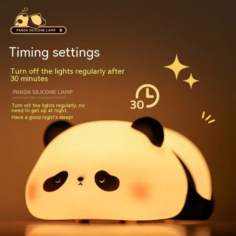 Cartoon panda-shaped silicone night light for children on a table.