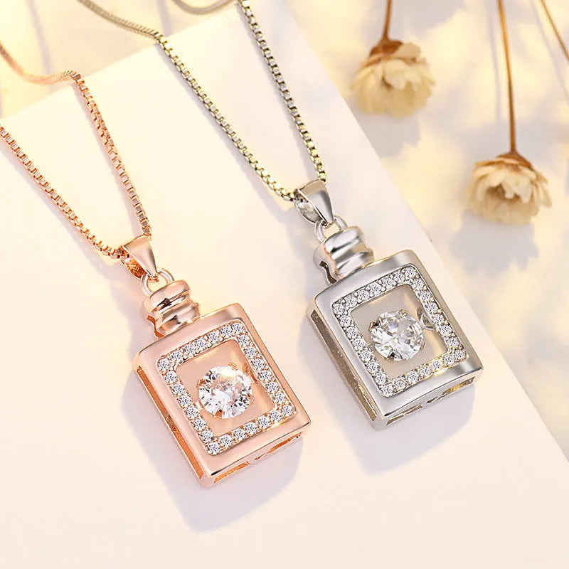 Sterling silver heart necklace with crown and bow design in rose gold or silver finish