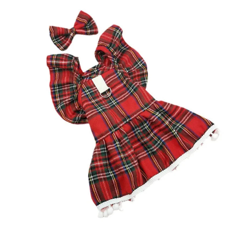 Pet wearing red Christmas tartan skirt with matching bow tie head flower