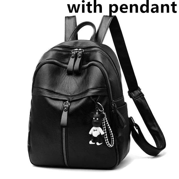 Black Pu leather backpack with soft surface, dual straps, and a large main compartment.