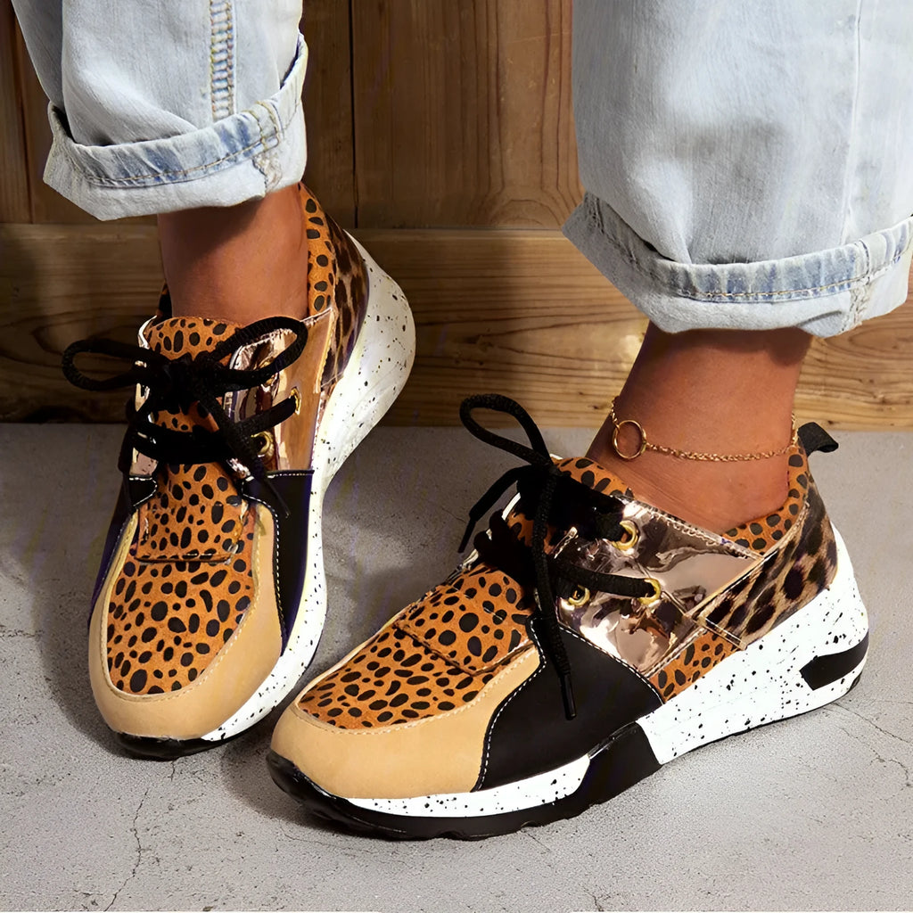 Women's suede casual flat sneakers with a wedge heel in leopard print.