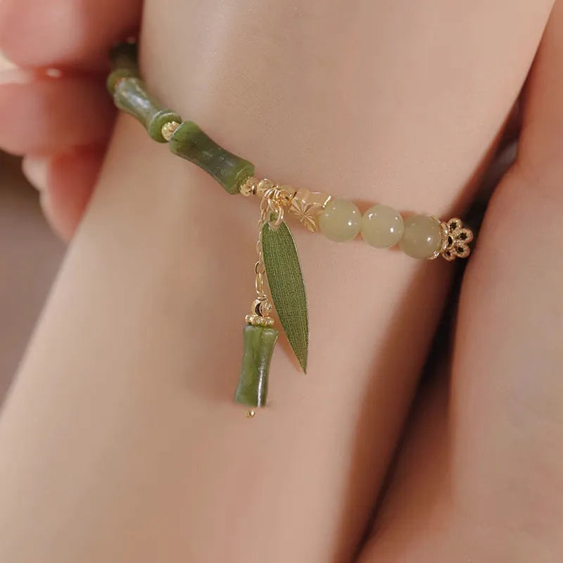 Chinese style glass bracelet with bamboo joint design elements in multiple colour options
