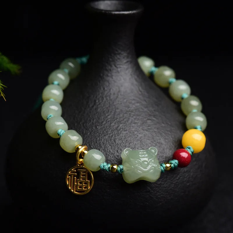 Natural Hetian jade bracelet with red cinnabar and amber beeswax beads, animal zodiac design
