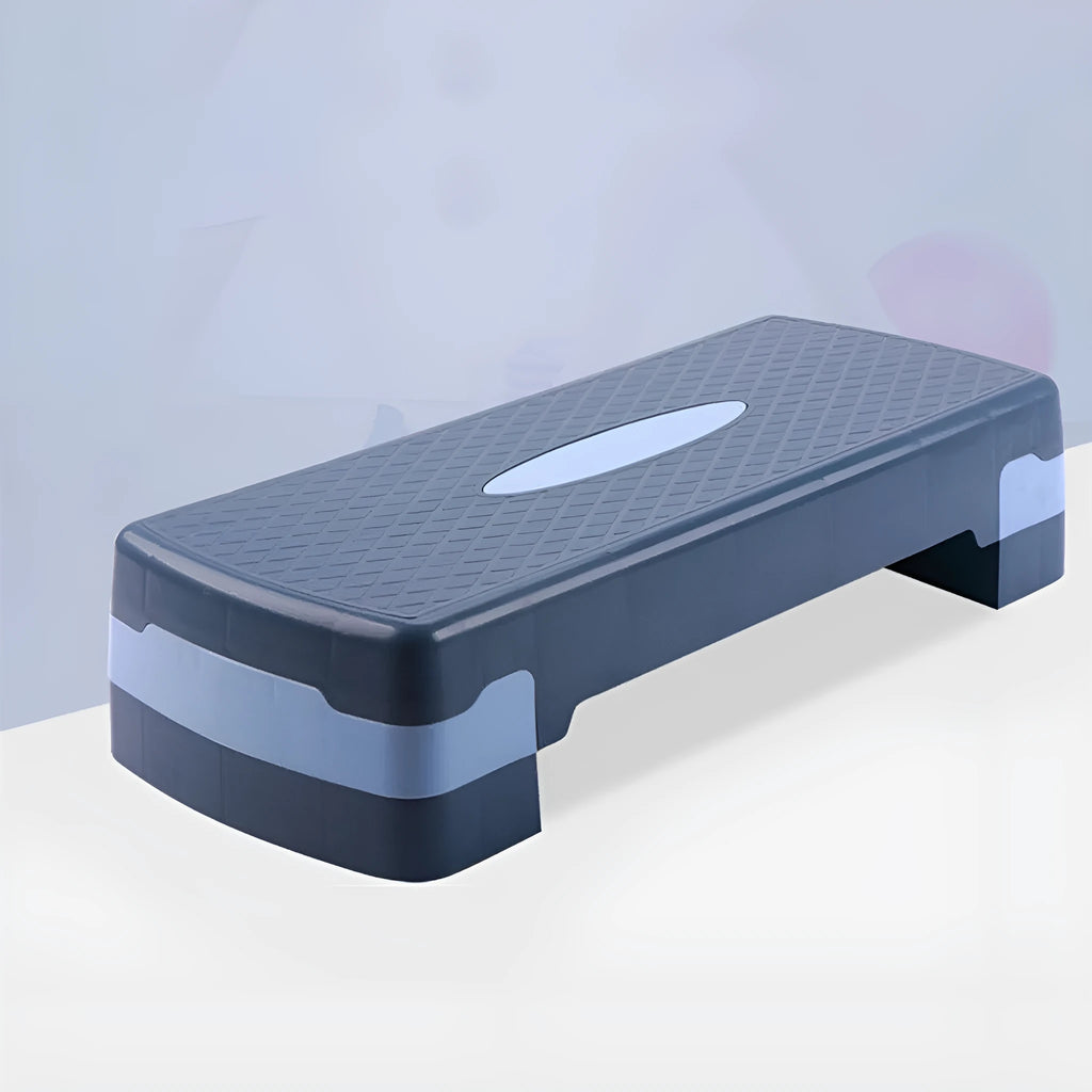 Grey Fit Step aerobics platform for fitness training on a floor.