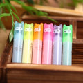 Set of six plastic highlighter pens with oblique chisel tips in different fluorescent colours.