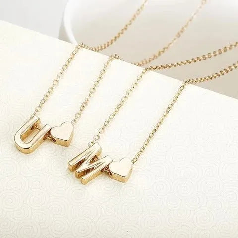 Peach heart shaped letter necklace pendant in gold and silver alloy colours.