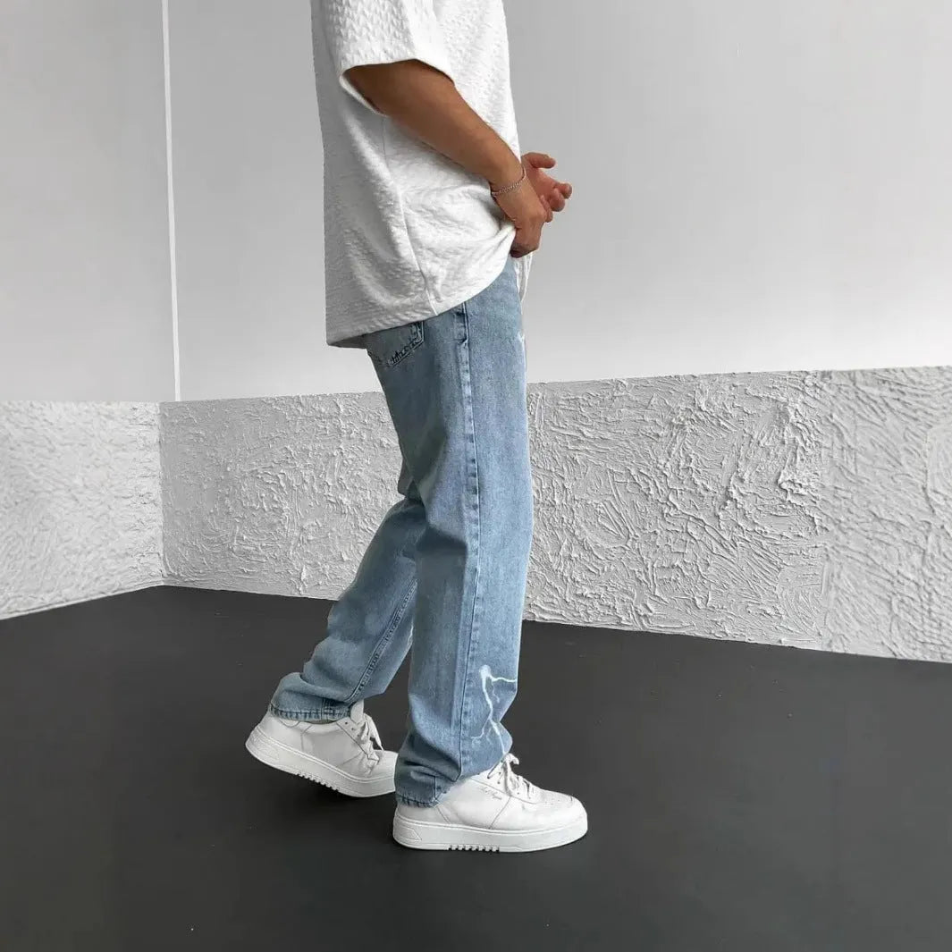 Men's blue straight-leg denim jeans with wide-leg fit and medium elasticity