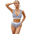 Leopard print women's bikini swimsuit with V-neck criss-cross band top and high-leg briefs.