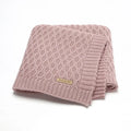 Solid colour acrylic infant blanket with textured lines in beige khaki, laid flat showing 70x90cm size.