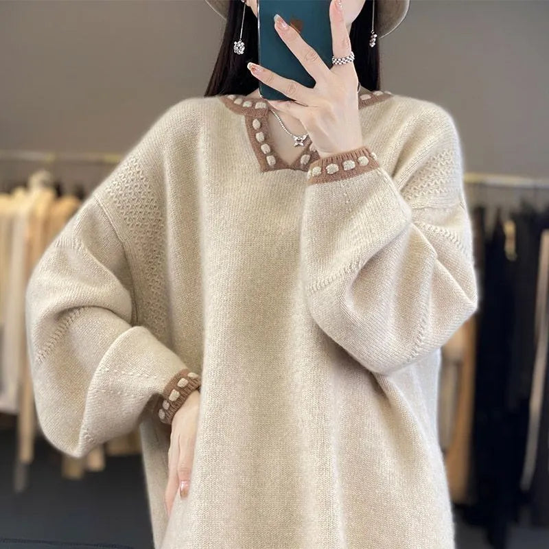 Women's camel coloured V-neck long sleeve pullover sweater made from viscose fibre fabric.