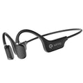 A person wearing bone conduction Bluetooth headphones with a wireless neckband sensor during a run.
