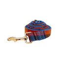 Four-piece dog accessory set with collar, leash, bow tie, and vest in cloth material