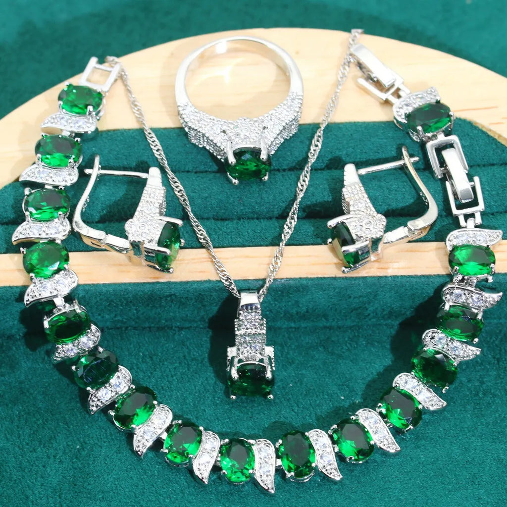 Bridal zircon and alloy four-piece jewellery set showing necklace, earrings, bracelet, and ring in white colour