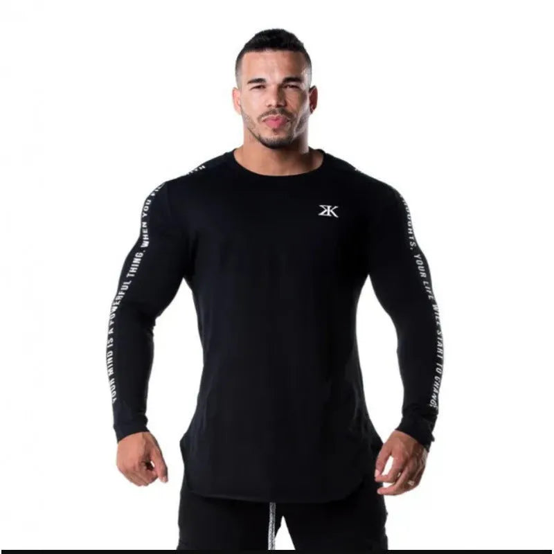 Men's milk silk long sleeve round neck fitness top with letter print in black, shown on a dark background