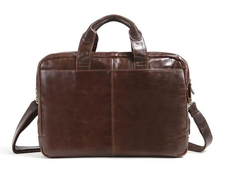 Brown leather business briefcase with visible cowhide pattern, measuring 18 inches with internal polyester cotton lining