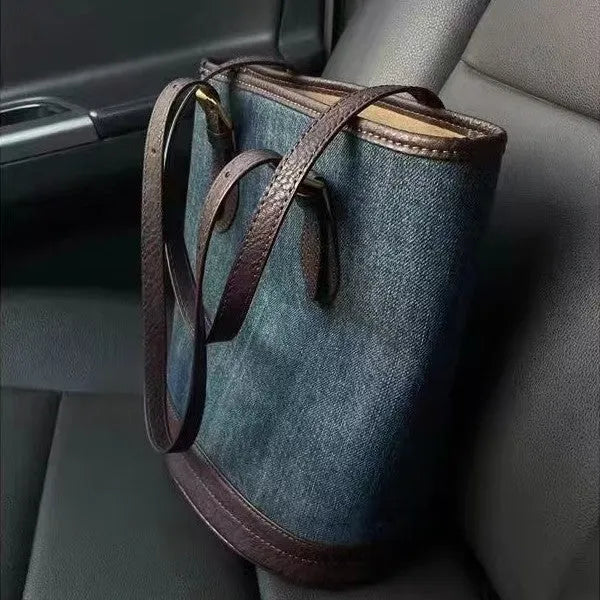 Denim patchwork bucket handbag with one shoulder strap showing retro styling