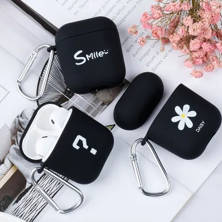 AirPods case cover in PC plastic with decorative patterns including flower and smiley face designs