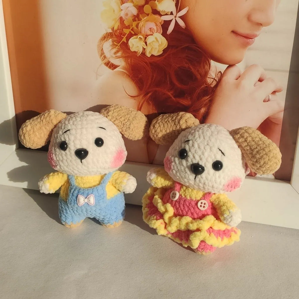 Handmade woollen zodiac dog pendant charm on a keychain, shown in pinafore dress style.