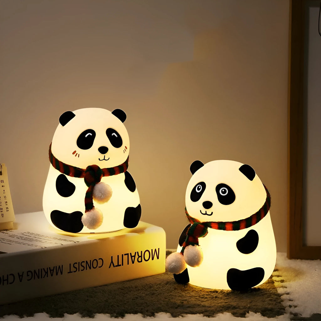 White panda-shaped silicone night light with black accents, showing its compact size and soft LED glow.