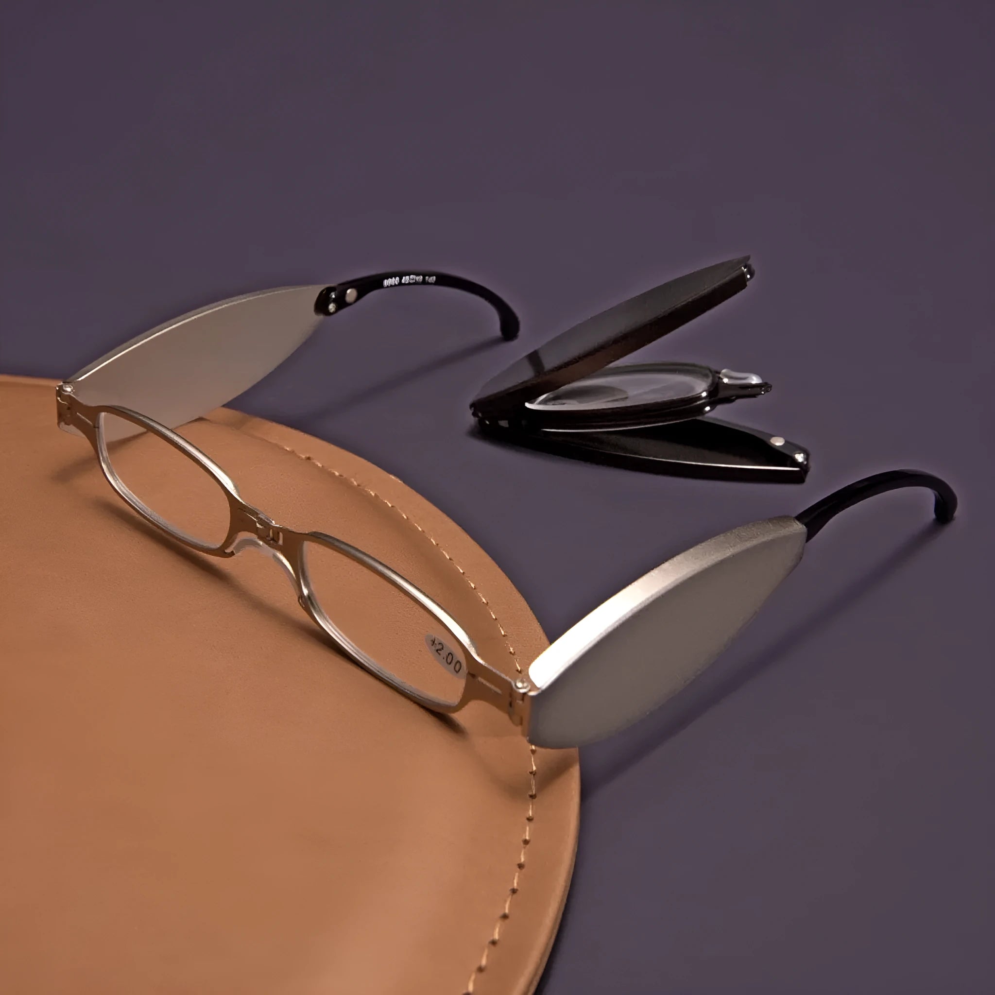 Black folding presbyopic glasses shown open and folded, with retro ring-style frame.