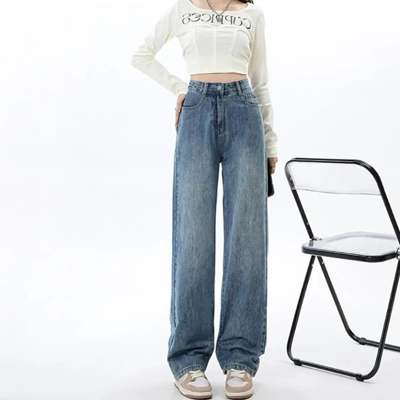 Women's retro blue high-waist wide-leg denim jeans laid flat