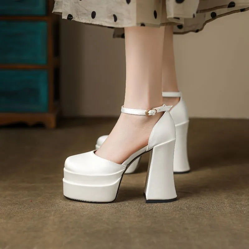 Women's white waterproof platform pumps with a chunky block heel and round toe on a neutral background.