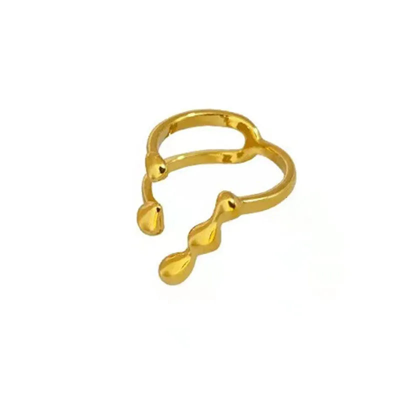 Brass ring with a spherical design on a circular band, shown in gold and silver finishes.