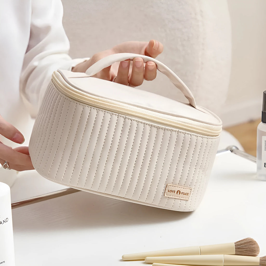 Open-top women's makeup bag in PU leather shown in a selection of solid colours.