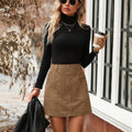 A woman's high waist short zip-front skirt in polyester fabric