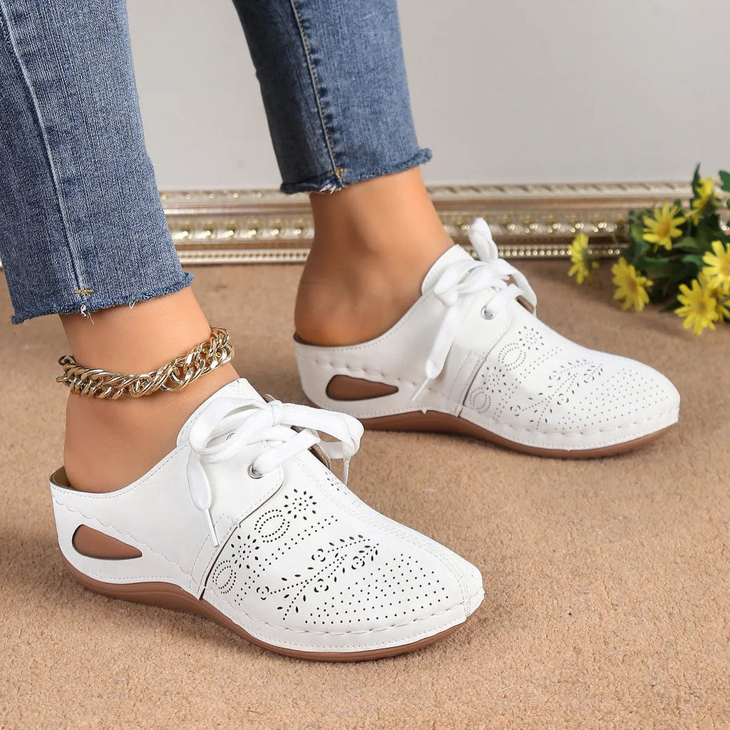 Women's black baotou lace-up slippers with hollow out wedge and suede upper on a rubber sole