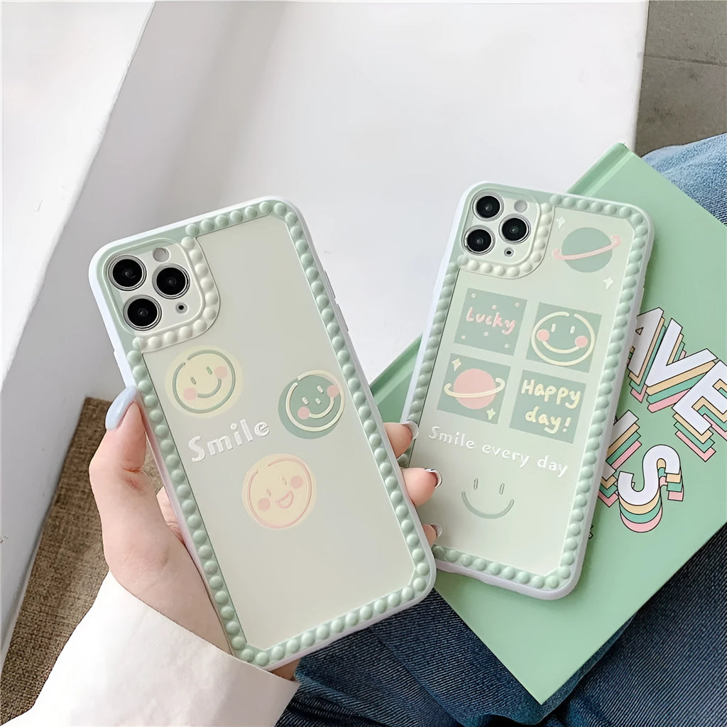 Green iPhone case with geometric smiley face designs and polka dot frames on flexible TPU material