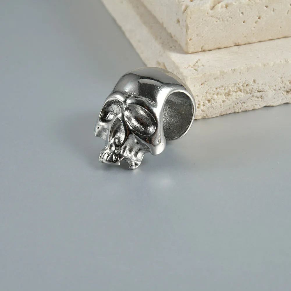 Stainless steel hollow skull Buddha head geometric earrings in four colour options.