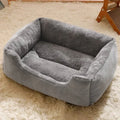 Short plush pet cushion bed for cats and dogs in grey colour, shown in L size 60x45 cm.