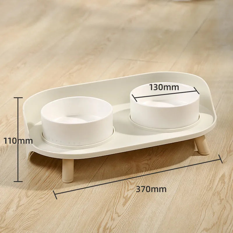 Green adjustable tilted double pet food bowl with spill-proof edges for cat and dog feeding