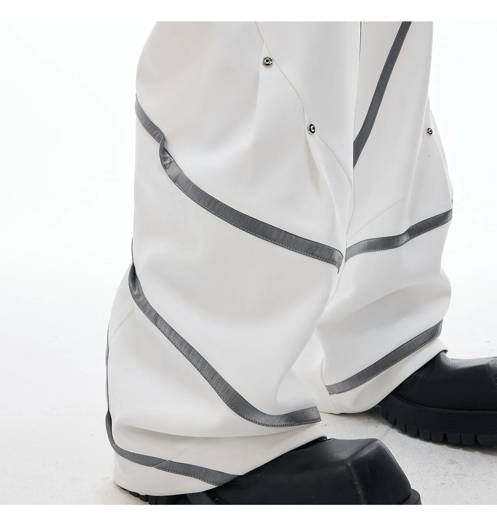 Men's polyester trousers with three-dimensional cutting and metal striped rivet pleated design in black and white colour options