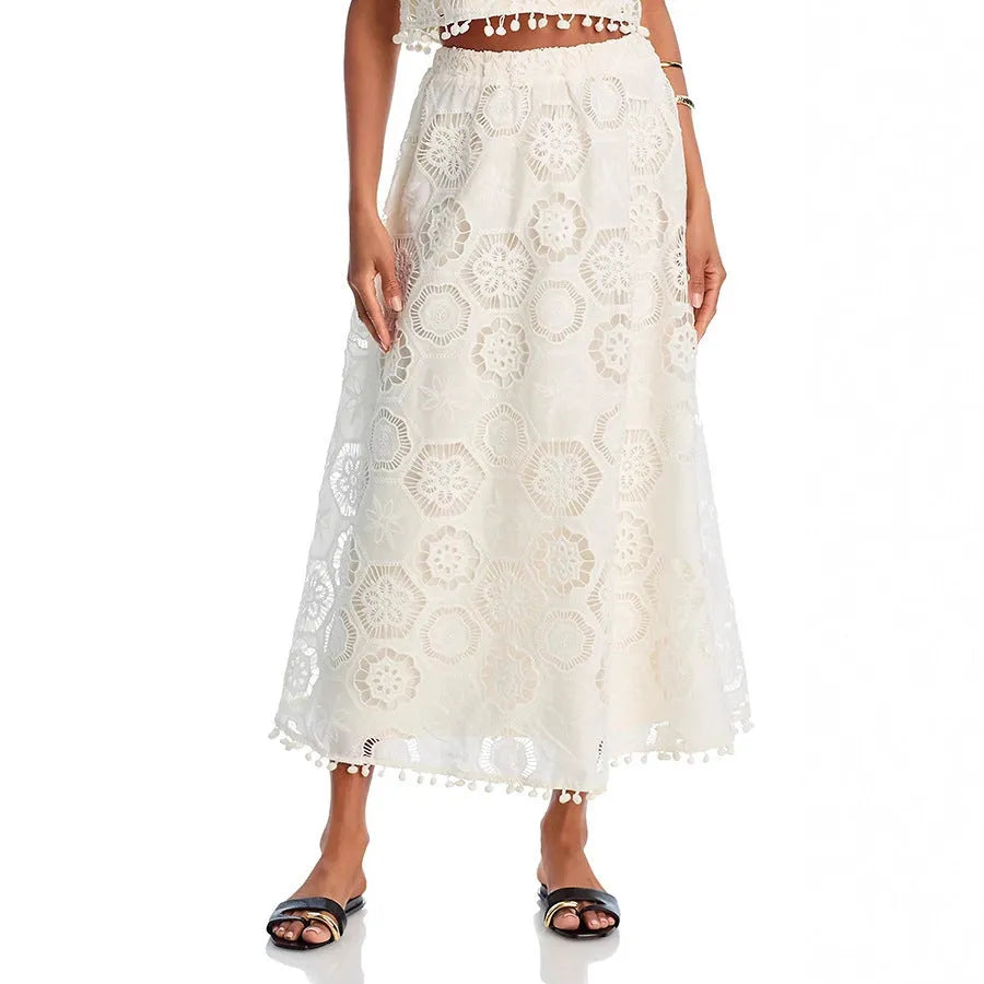 White women's sleeveless top and long skirt suit set with retro embroidery detail