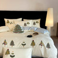 Cream Blue cotton duvet cover with embroidered Christmas tree and floral pattern, part of a four-piece bedding set.