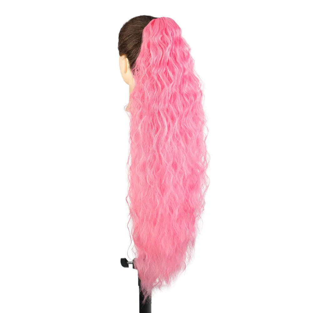 Long curly synthetic ponytail wig in high temperature fibre, 30 inches in length.