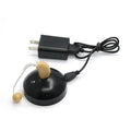 Black rechargeable hearing aid amplifier with silicone earplugs and a USB charging cable.