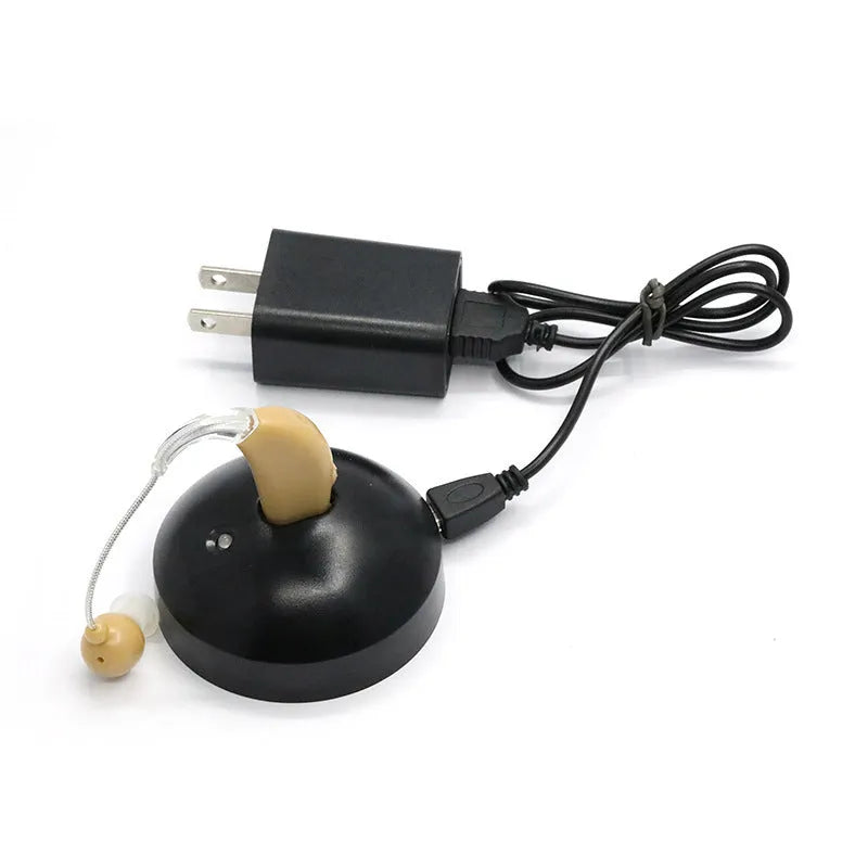 Black rechargeable hearing aid amplifier with silicone earplugs and a USB charging cable.