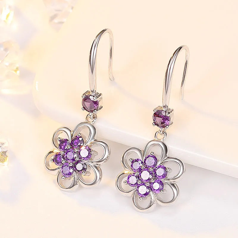 Floral white copper earrings with faceted stone accent, available as ear stud or ear hook in purple or white colour options