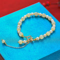 Women's Hetian jade pearl pendant bracelet with gold tone alloy clasp in Chinese style