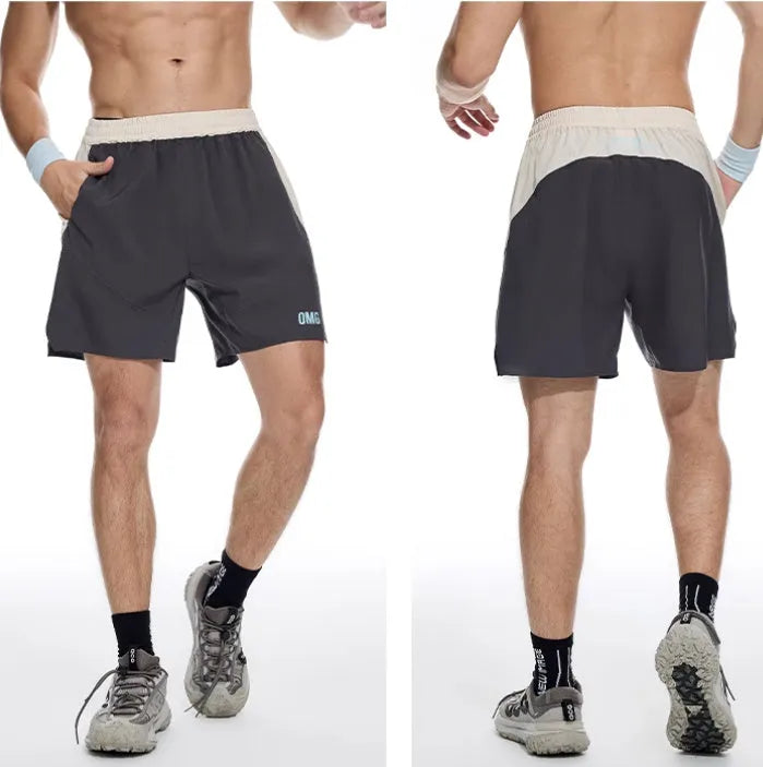 Men's loose grey Hipp workout lifting shorts with elastic lace-up fly on a plain background.