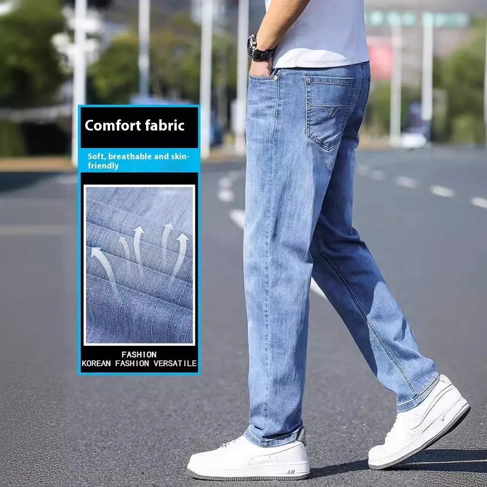 Men's thin stretch tapered denim trousers in light blue colour on a business casual model