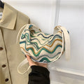 Women's woven straw crossbody bag showing internal phone and document pockets in corrugated brown colour