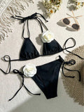 Black women's two-piece bikini with 3D floral lace detail on drawstring waistband, backless design.