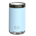 White portable USB humidifier with jellyfish mist spray and warm night light on wooden surface